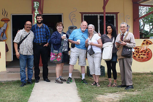 Self-Sufficiency Seminar attendees (with horticultural expert Thomas Barker, second from left) gathered outside the French bakery at San Ignacio's farmer's market. Photo courtesy of Andre Fortier