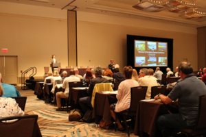 conference attendees listening to speaker