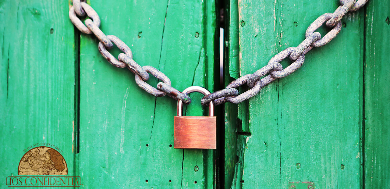 A lock on a wooden door. | Creating An Asset Protection Plan