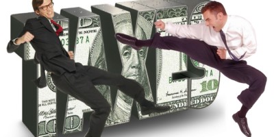 A guy karate kicking a man dressed up like an IRS agent with the word taxes in the background over a US$100 bill