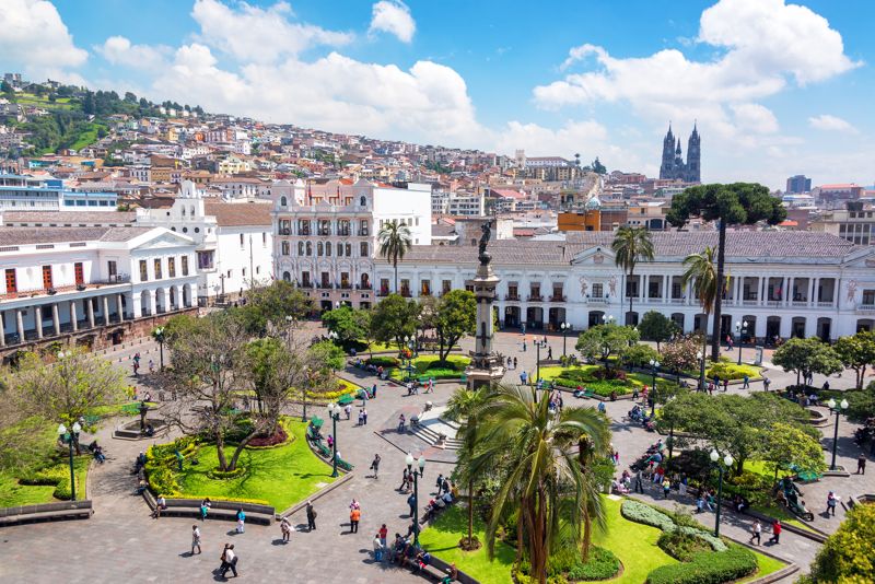 plaza grande ecuador view across the square and people walking around it