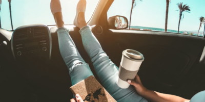 A relaxed traveller in a car