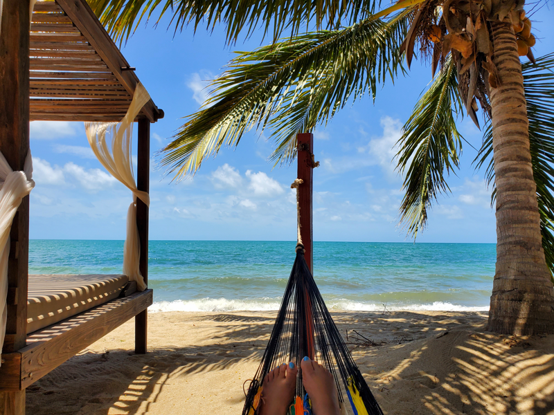 Back-To-Basics Lifestyle In Belize relaxing in a hammock