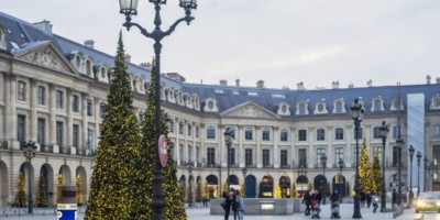 christmas trees outside buildings in paris
