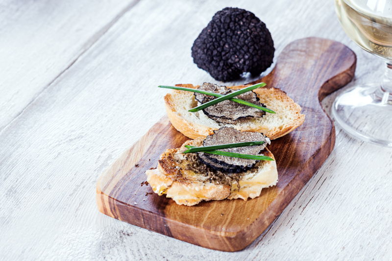 black truffles on a board