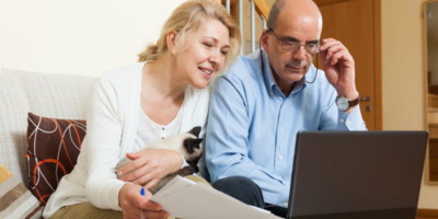 couple watching virtual conference online