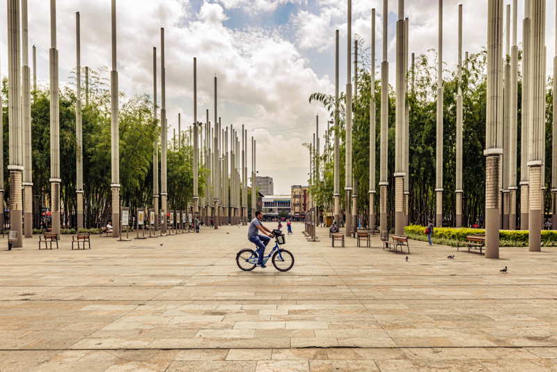 parc de las luces medellin person on a bike