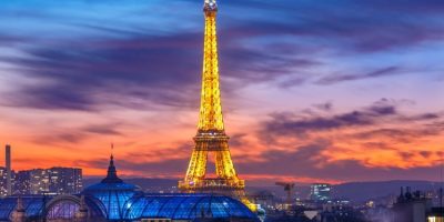 Shimmering Eiffel Tower at sunset in Paris, France.