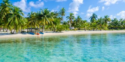 Small tropical island at Barrier Reef with paradise beach in Belize