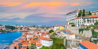 Cityscape panorama of Porto in sunset light, traditional architecture near Douro river in Portugal