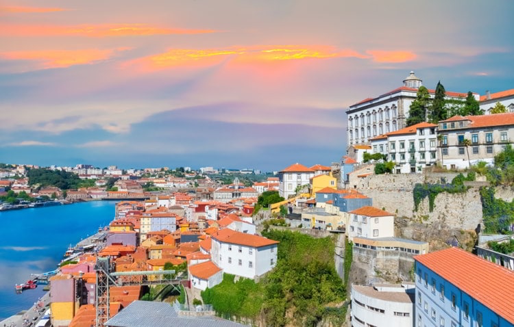 Cityscape panorama of Porto in sunset light, traditional architecture near Douro river in Portugal