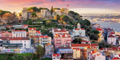 Lisbon, Portugal skyline with Sao Jorge Castle at dawn