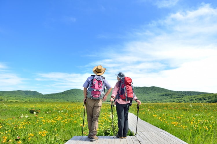 Senior couple hiking during summer