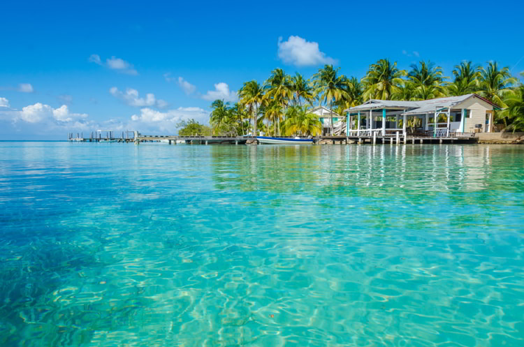 Small tropical island at Barrier Reef with paradise beach in Belize