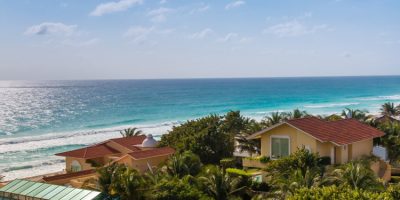 Caribbean tropical style houses on sea shore