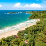 Tropical Island Aerial View. Wild coastline lush exotic green jungle in Panama
