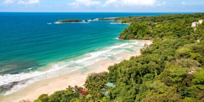 Tropical Island Aerial View. Wild coastline lush exotic green jungle in Panama