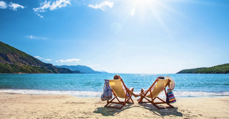 Happy couple relaxing on the beach