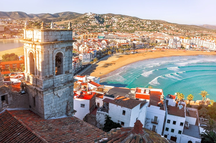 Beach and old buildings in Valencia Spain