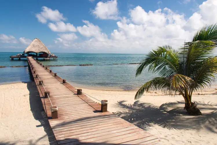 wooden pier leading to a beach in the caribbean