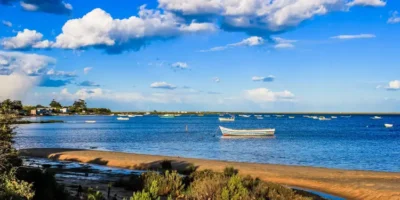Blue skies, boat on the ocean.